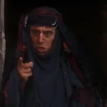 Brian's Mum (Terry Jones) in the film Life of Brian. Text: Corporate pseudo science is not the Messiah. Its a very naughty ploy! Now piss off!